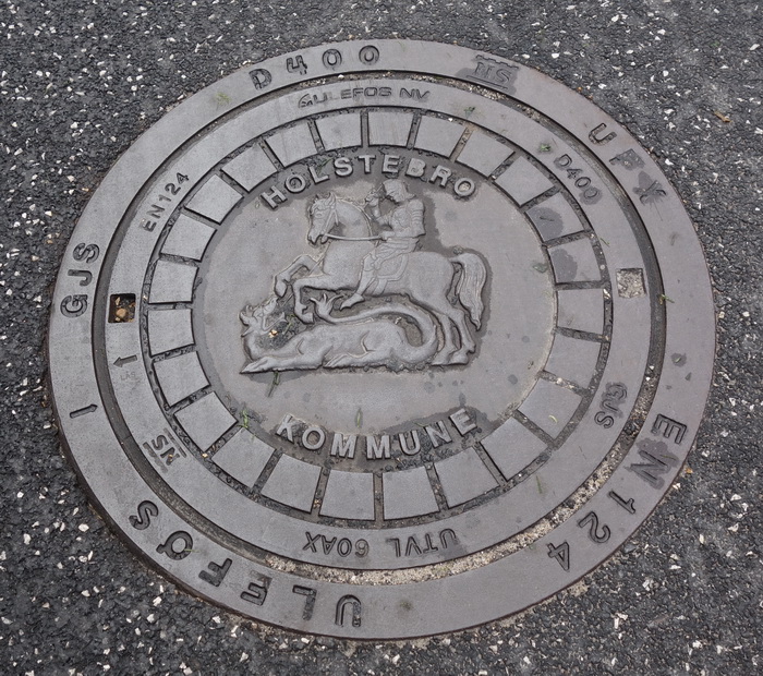 Jagdmotiv auf Gullideckel